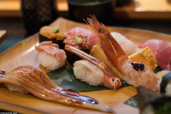 Chef hands rolling sushi